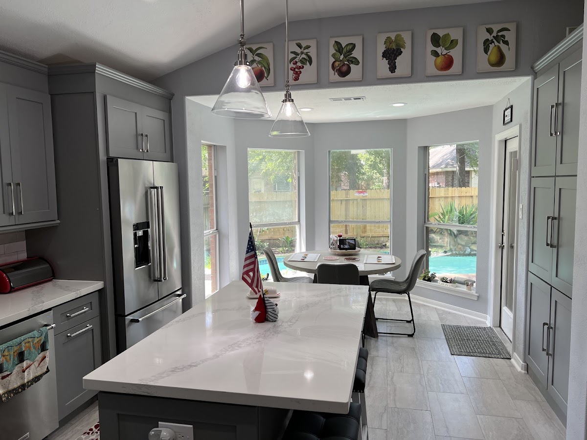 Gray kitchen remodel with bay window dining area