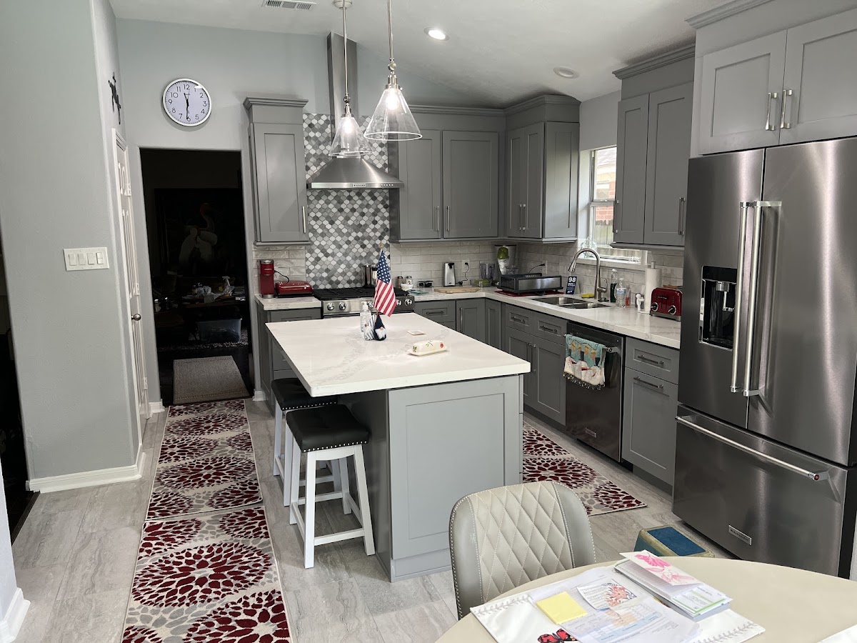 Kitchen with mosaic tile backsplash and island seating