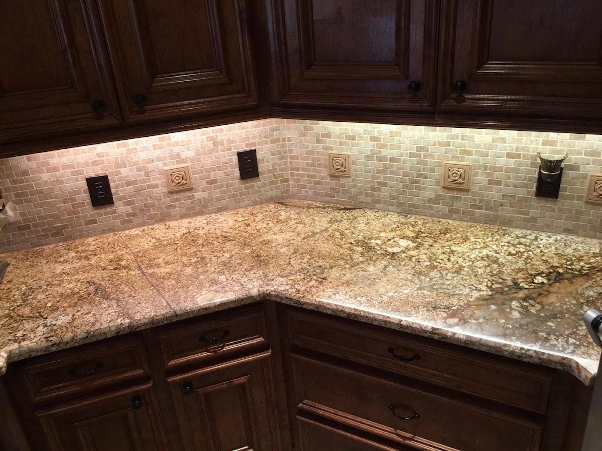 Granite countertop with tile backsplash
