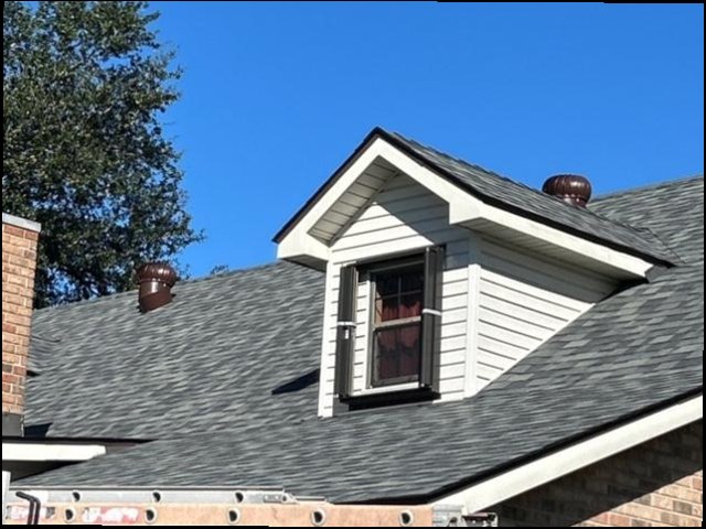 Shingle roof detail with copper vents