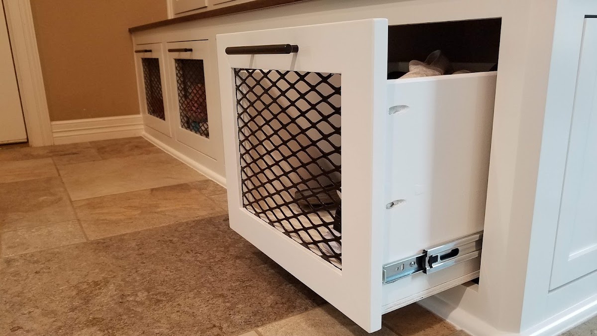 Custom laundry built-in with metal mesh hamper baskets