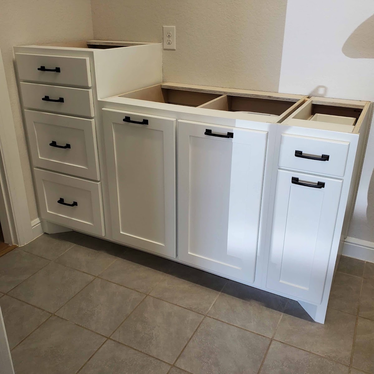 White shaker-style vanity cabinet in progress