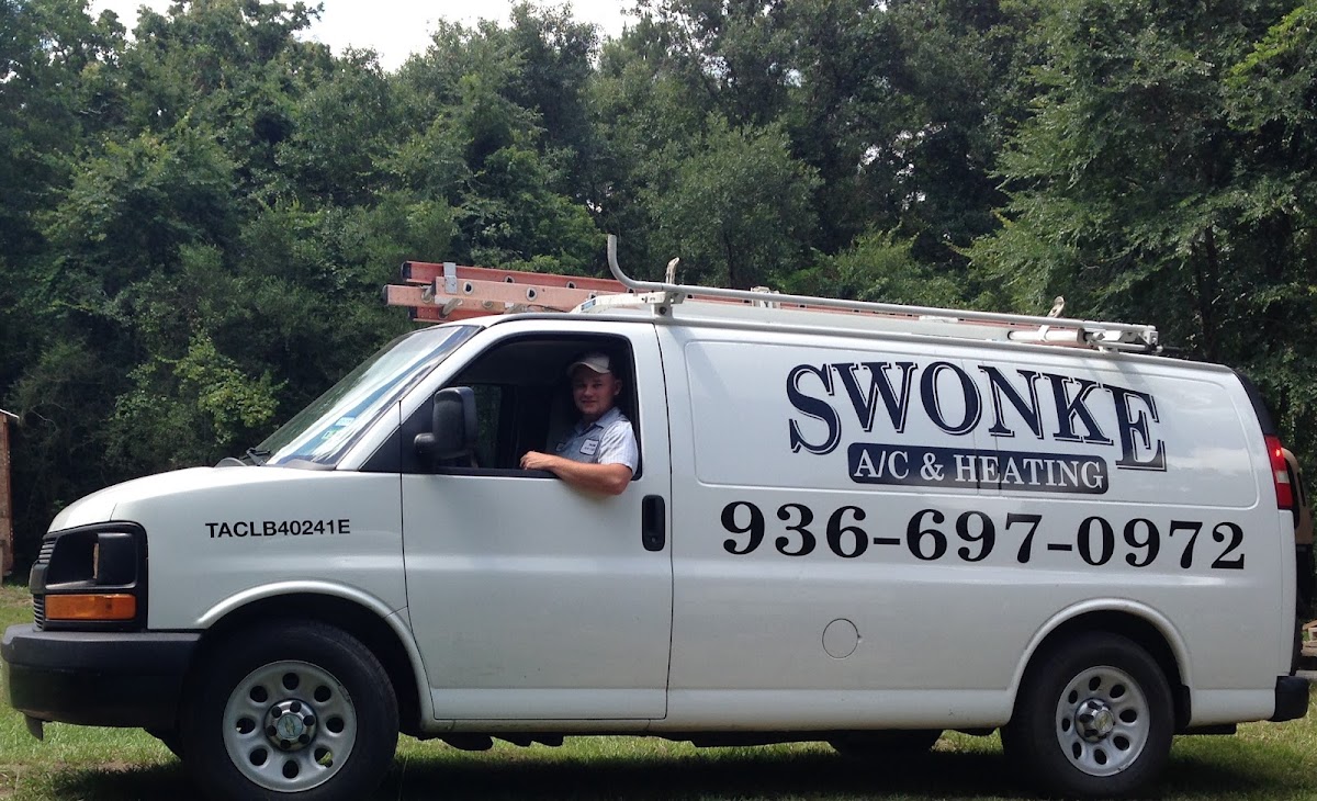 Swonke A/C & Heating branded service van with technician